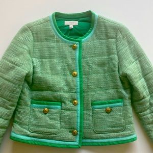 Beautiful green jacket with gold bottoms.